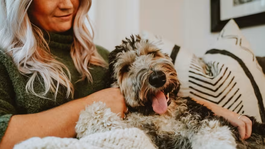 woman-snuggling-with-her-dog